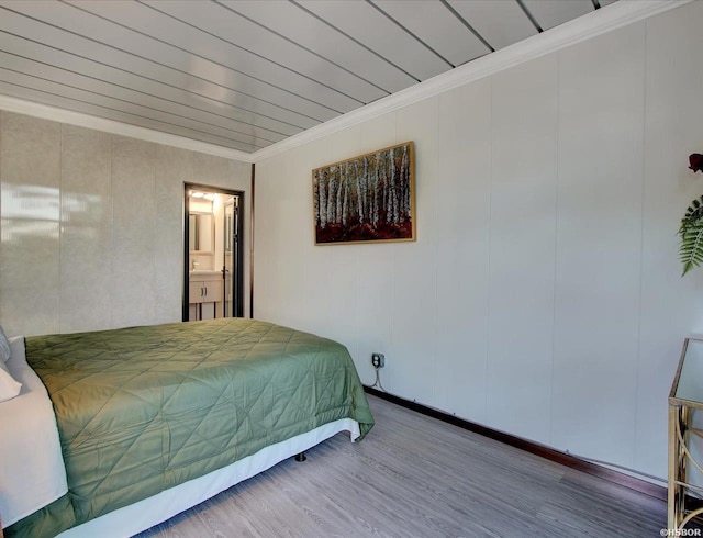bedroom featuring wood ceiling, crown molding, and wood finished floors