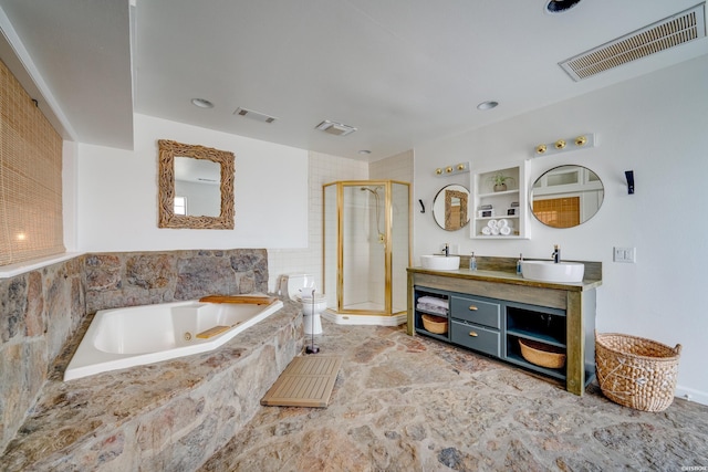 bathroom featuring visible vents, a sink, and toilet