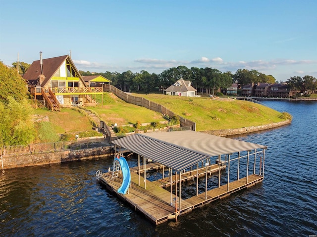 view of dock featuring a water view, boat lift, and stairs