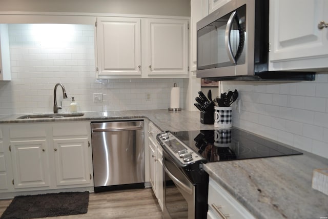 200 Hamilton Oaks Dr Unit J3, Hot Springs, AR 71913 - kitchen featuring stainless steel appliances, a sink, tasteful backsplash, and white cabinetry