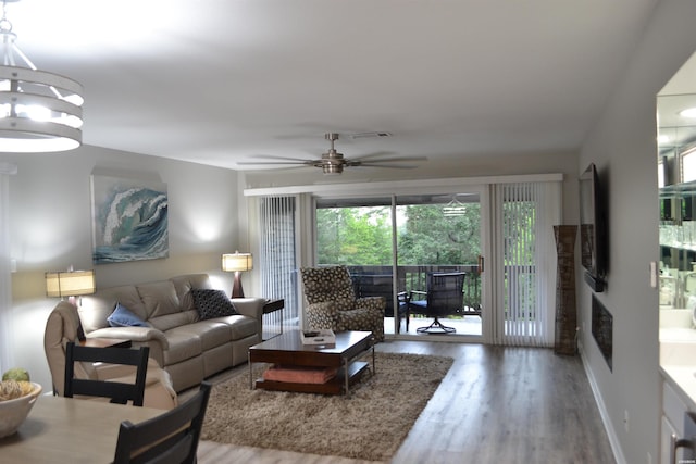 200 Hamilton Oaks Dr Unit J3, Hot Springs, AR 71913 - living area with wood finished floors, ceiling fan, and a chandelier