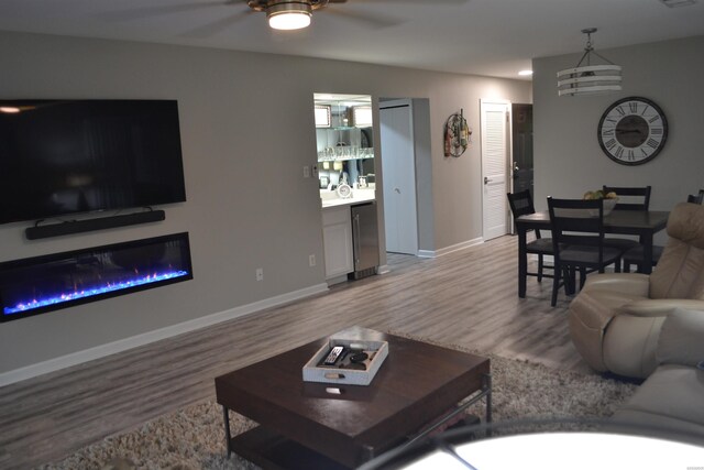 200 Hamilton Oaks Dr Unit J3, Hot Springs, AR 71913 - living area with ceiling fan, wood finished floors, and baseboards