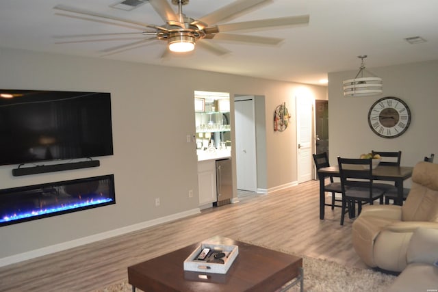 200 Hamilton Oaks Dr Unit J3, Hot Springs, AR 71913 - living area with light wood-style floors, ceiling fan, and baseboards