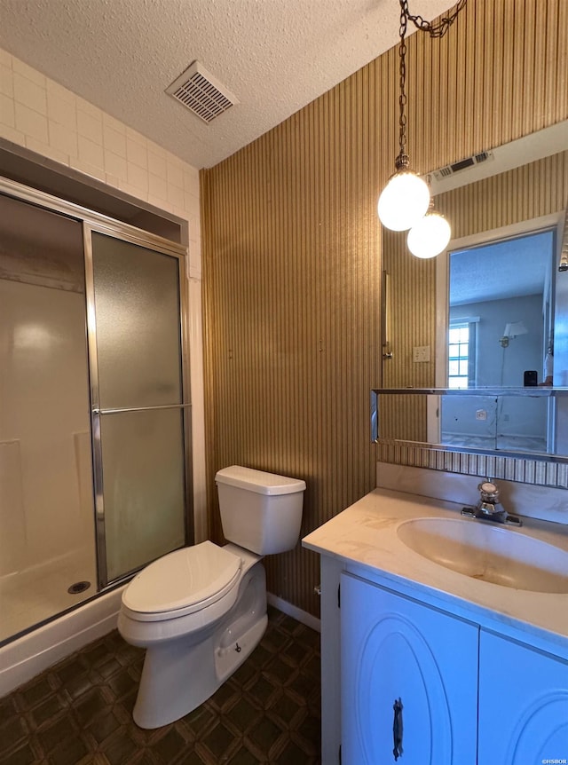 600 Higdon Ferry Rd Unit 203, Hot Springs, AR 71901 - full bath featuring a stall shower, toilet, tile patterned floors, vanity, and a textured ceiling