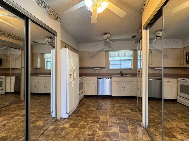 600 Higdon Ferry Rd Unit 203, Hot Springs, AR 71901 - kitchen with white appliances, ceiling fan, a sink, a textured ceiling, and white cabinetry