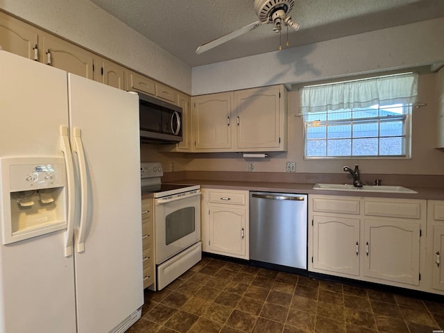 600 Higdon Ferry Rd Unit 203, Hot Springs, AR 71901 - kitchen featuring stainless steel appliances, a sink, a ceiling fan, a textured ceiling, and white cabinets