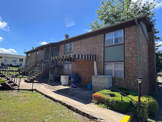 600 Higdon Ferry Rd Unit 203, Hot Springs, AR 71901 - rear view of house featuring a patio area, brick siding, and stairs