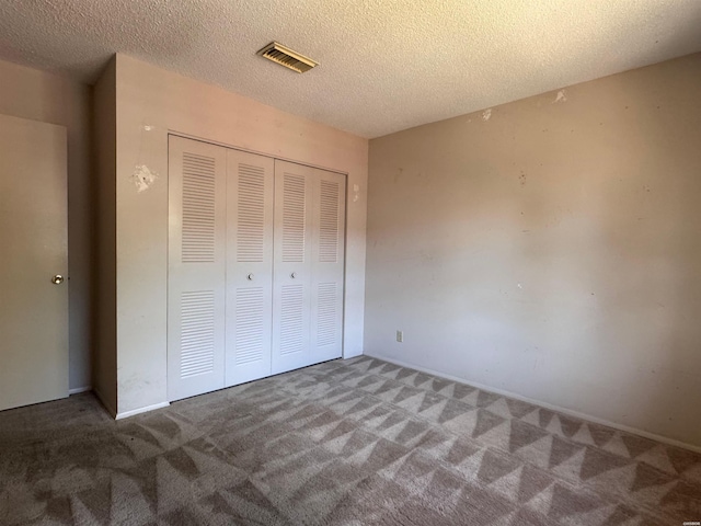 600 Higdon Ferry Rd Unit 203, Hot Springs, AR 71901 - unfurnished bedroom featuring carpet floors, a closet, and a textured ceiling