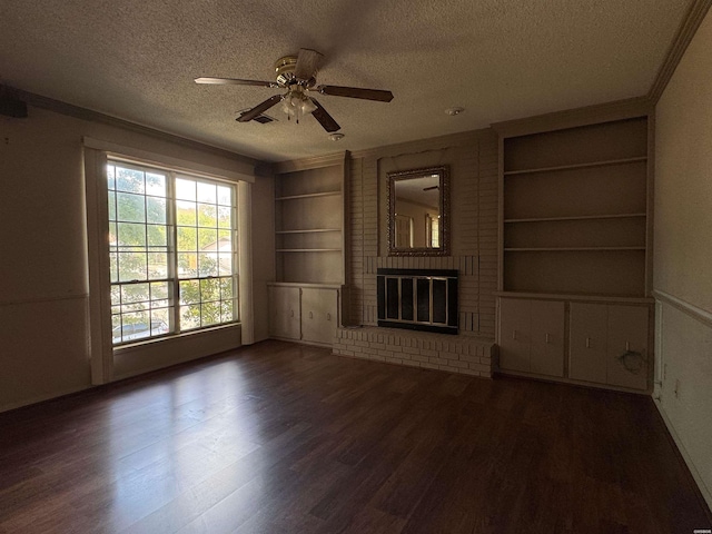 600 Higdon Ferry Rd Unit 203, Hot Springs, AR 71901 - unfurnished living room featuring a textured ceiling, built in shelves, wood finished floors, ceiling fan, and a brick fireplace