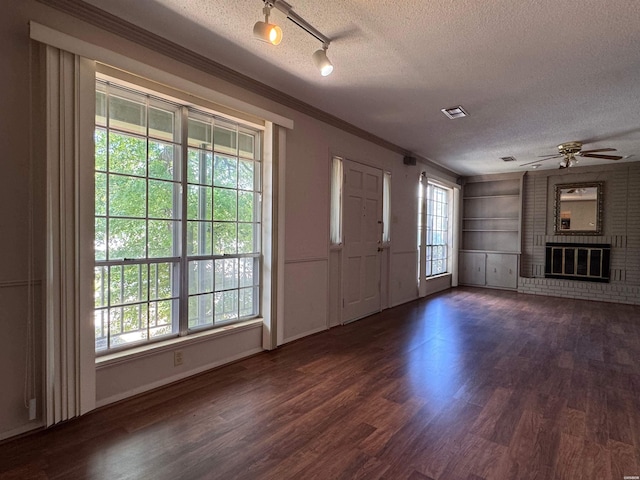 600 Higdon Ferry Rd Unit 203, Hot Springs, AR 71901 - entryway featuring a textured ceiling, ornamental molding, dark wood-style floors, a ceiling fan, and rail lighting