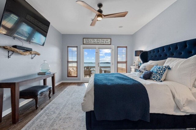 bedroom with baseboards, wood finished floors, a ceiling fan, and access to exterior