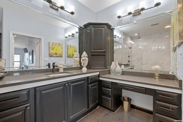 bathroom with tile patterned floors, visible vents, walk in shower, and vanity