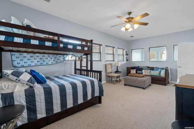 carpeted bedroom with visible vents and baseboards