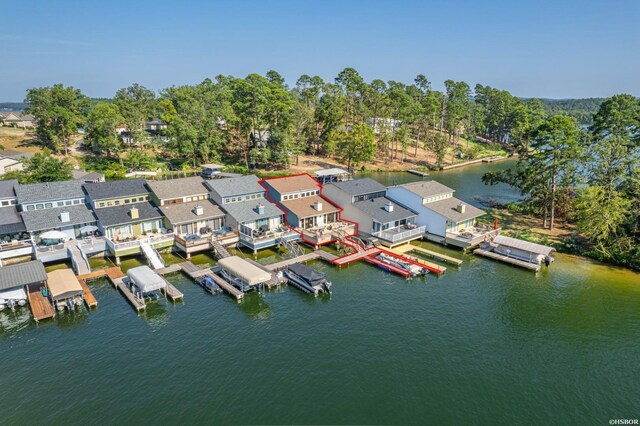 drone / aerial view featuring a water view and a residential view