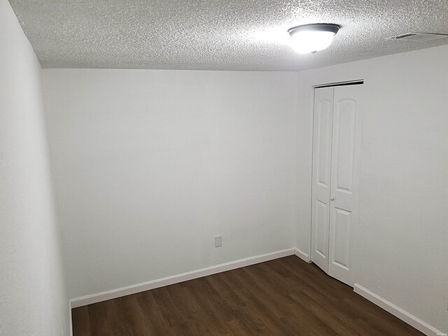 186 Vanadium Cir, Hot Springs, AR 71901 - empty room with dark wood-type flooring, baseboards, and a textured ceiling