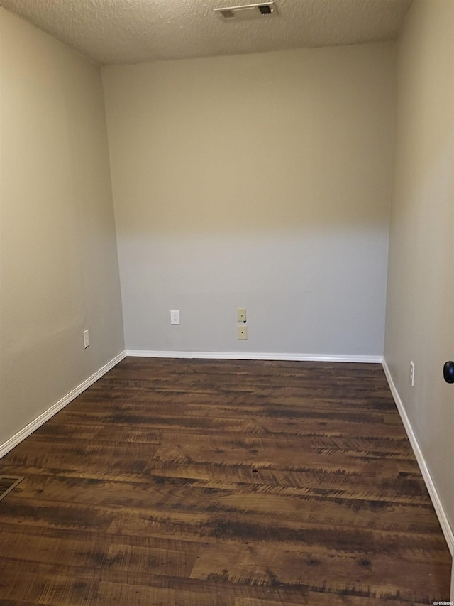 186 Vanadium Cir, Hot Springs, AR 71901 - empty room featuring baseboards, visible vents, and dark wood-style flooring
