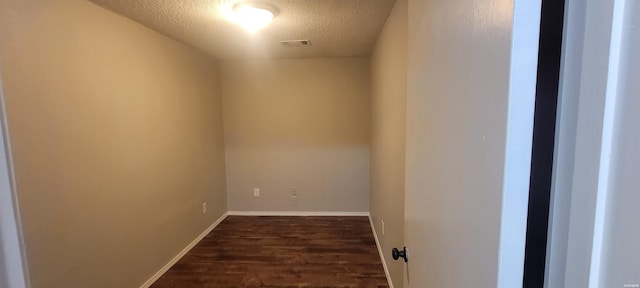 186 Vanadium Cir, Hot Springs, AR 71901 - interior space featuring baseboards, visible vents, a textured ceiling, and dark wood-style flooring