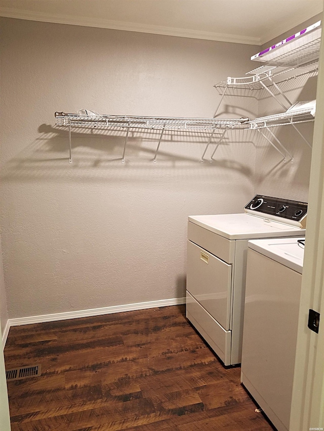 186 Vanadium Cir, Hot Springs, AR 71901 - laundry room featuring ornamental molding, dark wood-style flooring, washing machine and clothes dryer, and laundry area