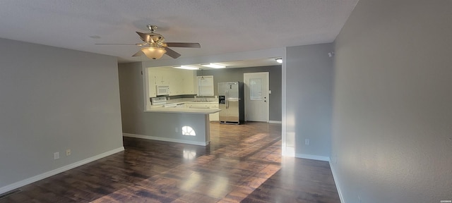 186 Vanadium Cir, Hot Springs, AR 71901 - kitchen with ceiling fan, baseboards, a peninsula, white microwave, and stainless steel fridge with ice dispenser