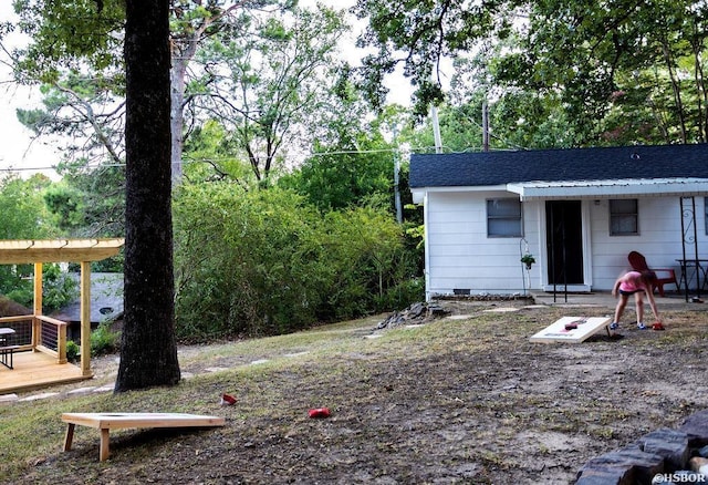 view of yard with a wooden deck