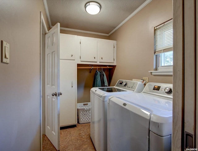 washroom with a textured ceiling, independent washer and dryer, cabinet space, and crown molding