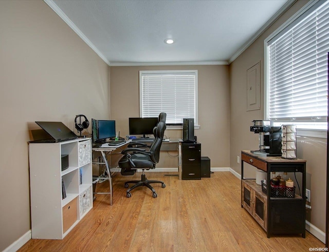 home office featuring ornamental molding, baseboards, and light wood finished floors