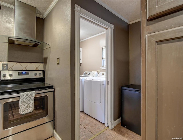 interior space with a textured ceiling, a textured wall, laundry area, washing machine and clothes dryer, and crown molding