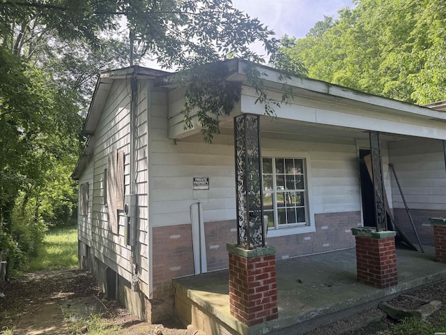 244 Silver St, Hot Springs, AR 71901 - view of property exterior featuring brick siding and covered porch