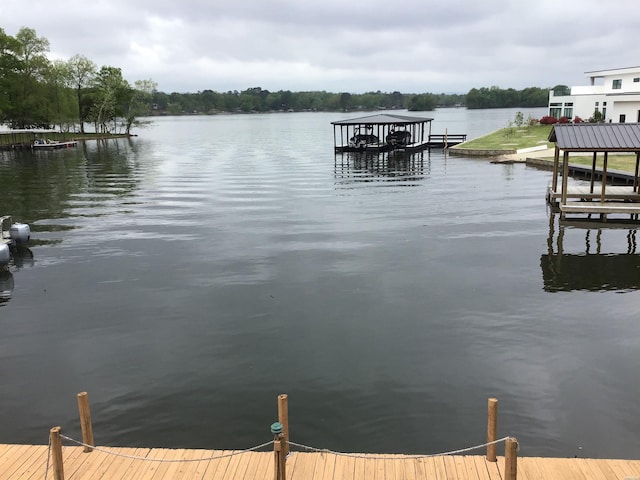 dock area featuring a water view and boat lift