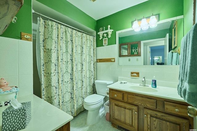 full bathroom with vanity, tile walls, a shower with shower curtain, and toilet