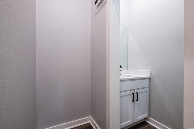 bathroom featuring vanity and baseboards