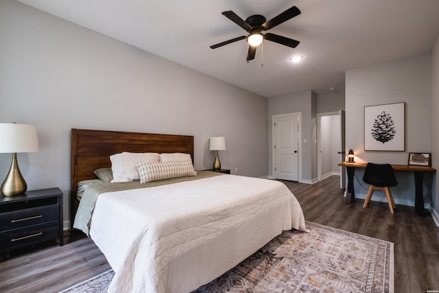 bedroom featuring wood finished floors, ceiling fan, and baseboards