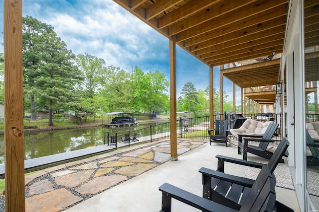view of patio with a water view