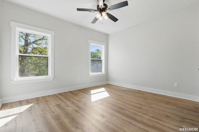 132 Lombard Ct, Hot Springs, AR 71901 - empty room with baseboards, light wood finished floors, and a healthy amount of sunlight
