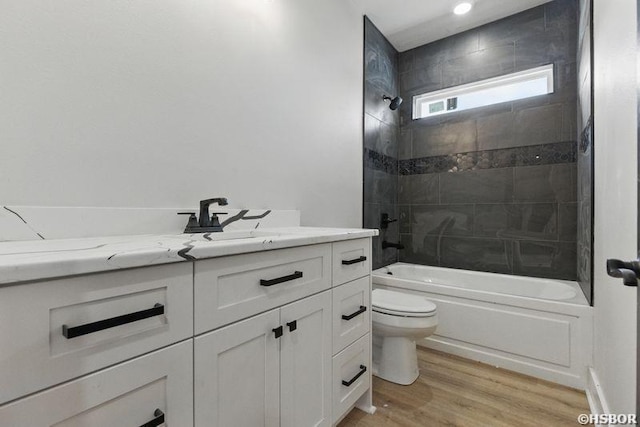 132 Lombard Ct, Hot Springs, AR 71901 - bathroom featuring toilet, wood finished floors, vanity, and shower / bathtub combination