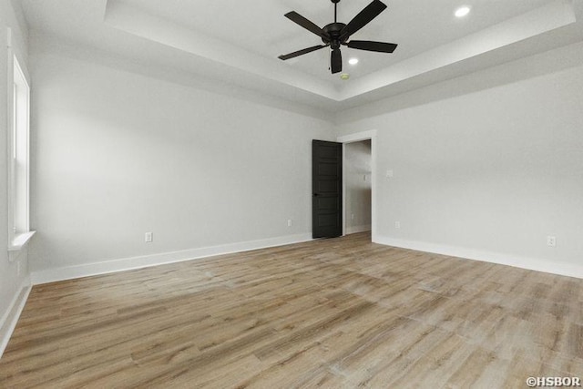 132 Lombard Ct, Hot Springs, AR 71901 - unfurnished room featuring a raised ceiling, baseboards, and light wood-style flooring