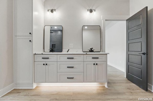 132 Lombard Ct, Hot Springs, AR 71901 - full bathroom with walk in shower, double vanity, and wood finished floors