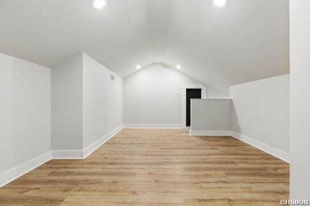 132 Lombard Ct, Hot Springs, AR 71901 - additional living space with light wood-type flooring, visible vents, vaulted ceiling, recessed lighting, and baseboards