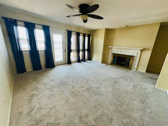 142 Lake Hamilton Dr Unit 410, Hot Springs, AR 71913 - unfurnished living room featuring carpet flooring, ceiling fan, a textured ceiling, and a fireplace