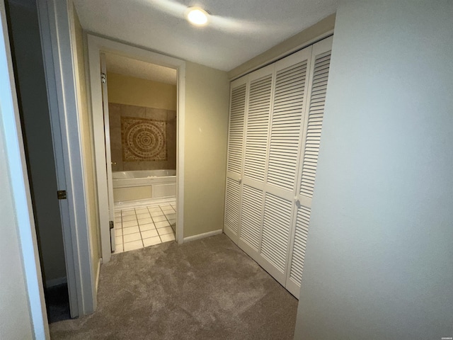 142 Lake Hamilton Dr Unit 410, Hot Springs, AR 71913 - hall with tile patterned floors, carpet floors, and baseboards