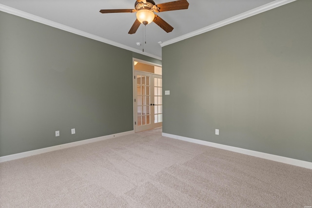 unfurnished room featuring french doors, baseboards, light carpet, and ornamental molding