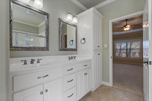 bathroom with visible vents, ceiling fan, ornamental molding, tile patterned floors, and a sink