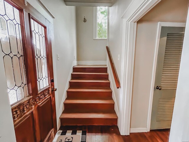 interior space featuring wood finished floors and baseboards