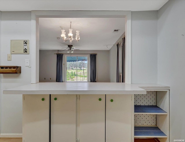 509 Belvedere Dr Unit B4, Hot Springs, AR 71901 - kitchen with a chandelier, light countertops, and a peninsula