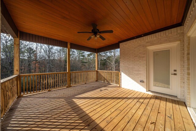 wooden deck featuring a ceiling fan