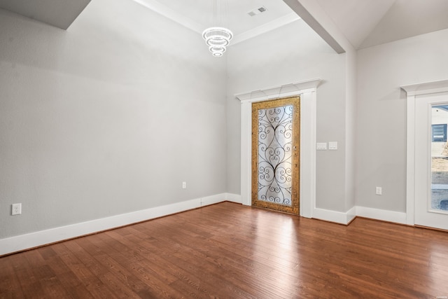 interior space with wood finished floors, visible vents, and baseboards