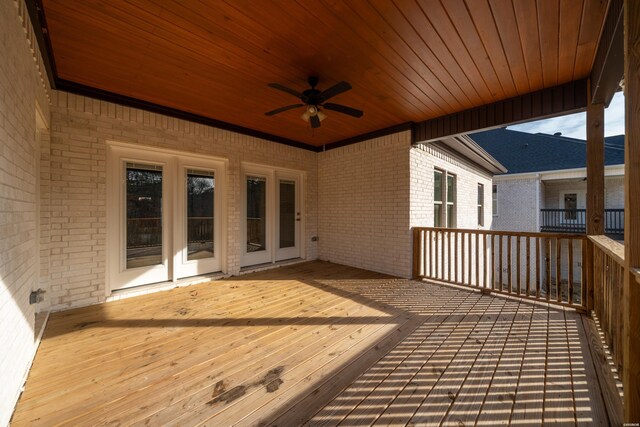 wooden deck with a ceiling fan