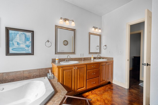 full bath with double vanity, a sink, a bath, and finished concrete floors