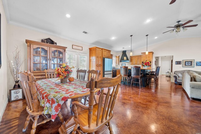 dining area featuring finished concrete flooring, visible vents, vaulted ceiling, crown molding, and recessed lighting