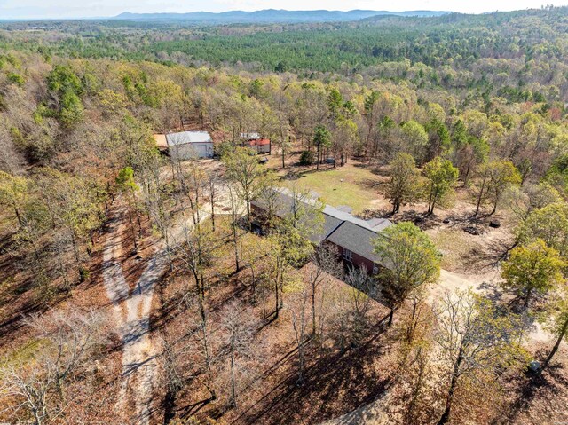 birds eye view of property with a wooded view